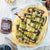 Veganer Flammkuchen mit Zucchini und Blaubeeren und Naughty Nuts BIO Mandelmus Blueberry Bash